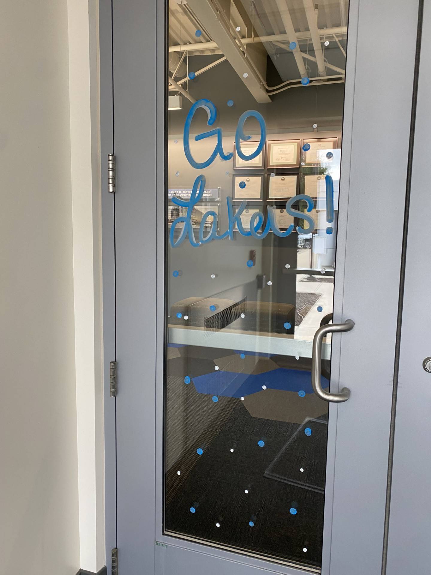 Facilities Planning Homecoming decorations, "Go Lakers" window painted on front door